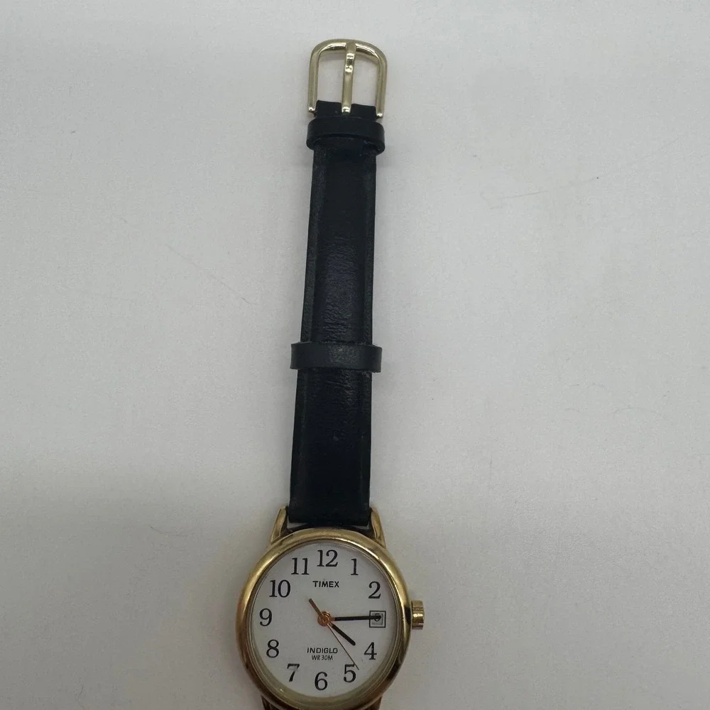 Timex Indiglo WR 30M Gold Tone White Dial Black Leather Watch CR 1216 needs bat